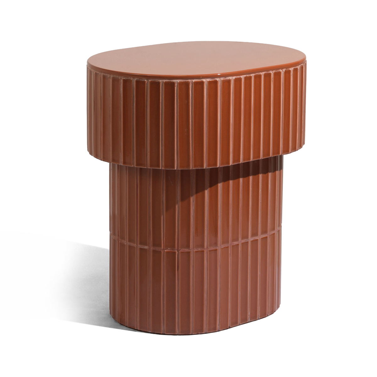 A modern oval side table or stool with a grooved ceramic tiled finish featuring a round top and a warm brown color, shown on a plain background.