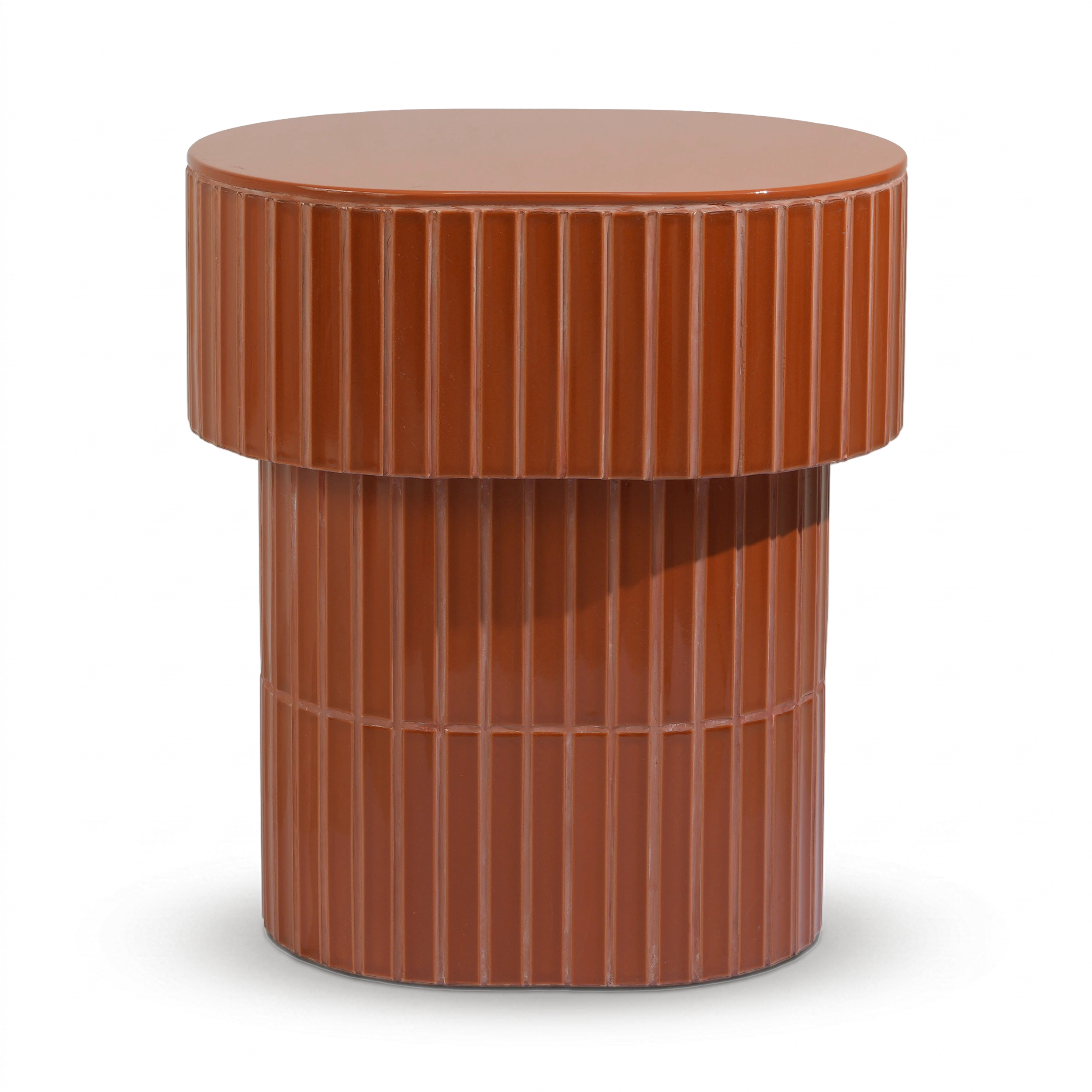 A modern oval side table or stool with a grooved ceramic tiled finish featuring a round top and a warm brown color, shown on a plain background.